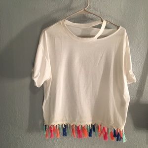 White shirt with colorful tassels